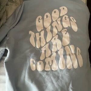 Blue hood with words on the back